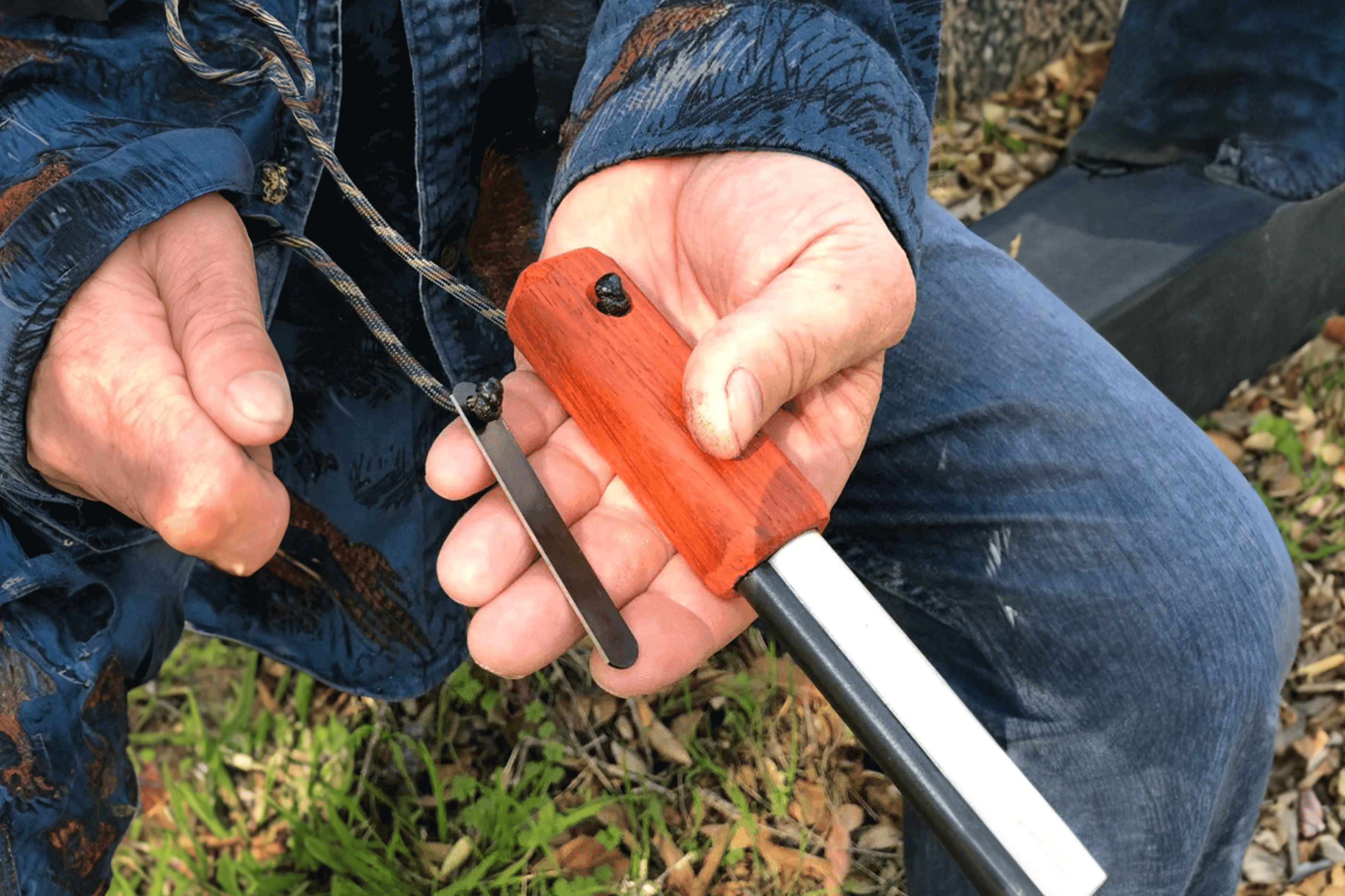 Person using 76% Rare Earth Metal Fire-Fast Trekker fire starter in outdoor setting – genuine Austrian ferrocerium for reliable sparks