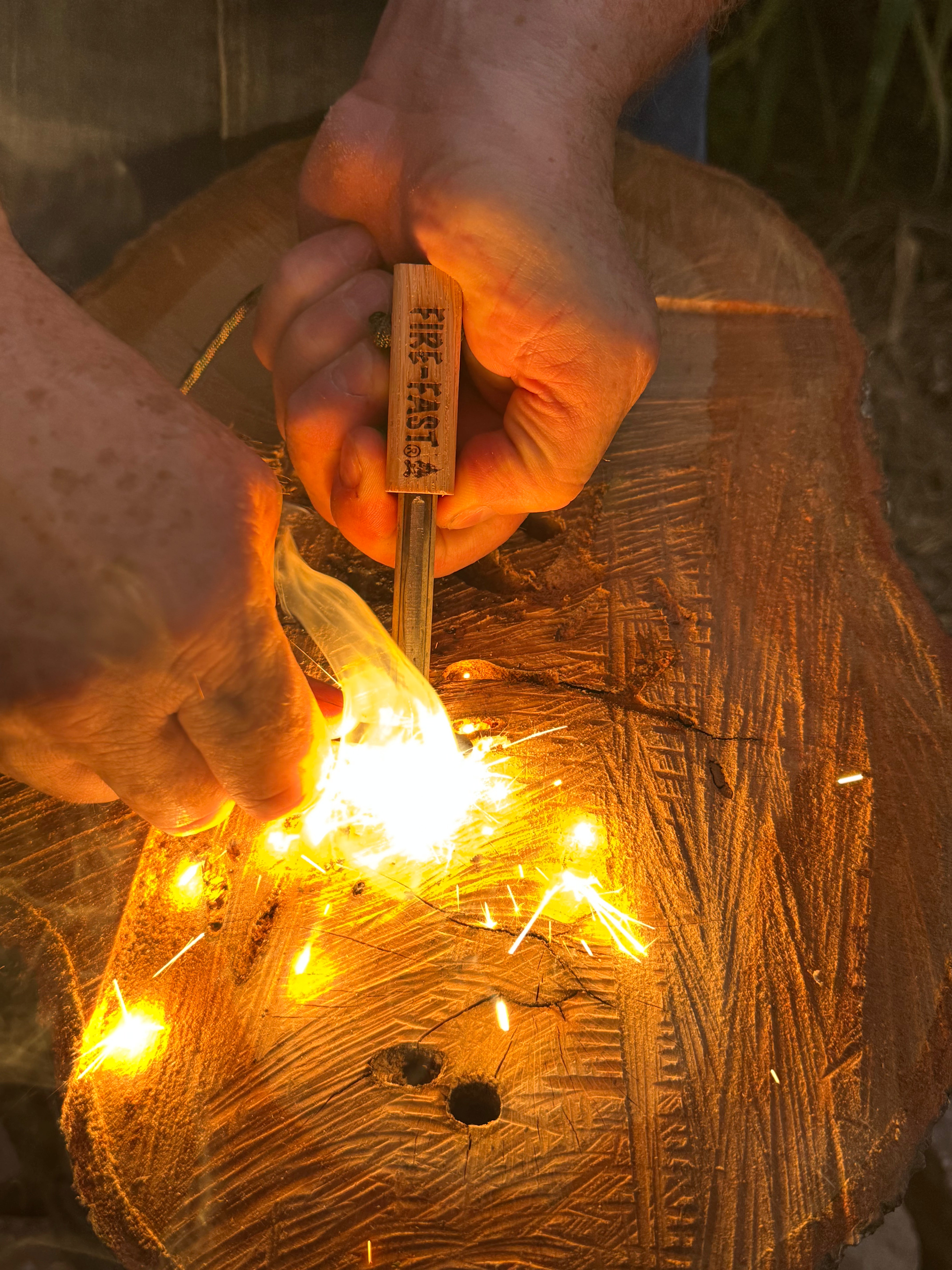 Fire-Fast Firefly Mini producing sparks from ferrocerium rod when struck with carbon steel striker