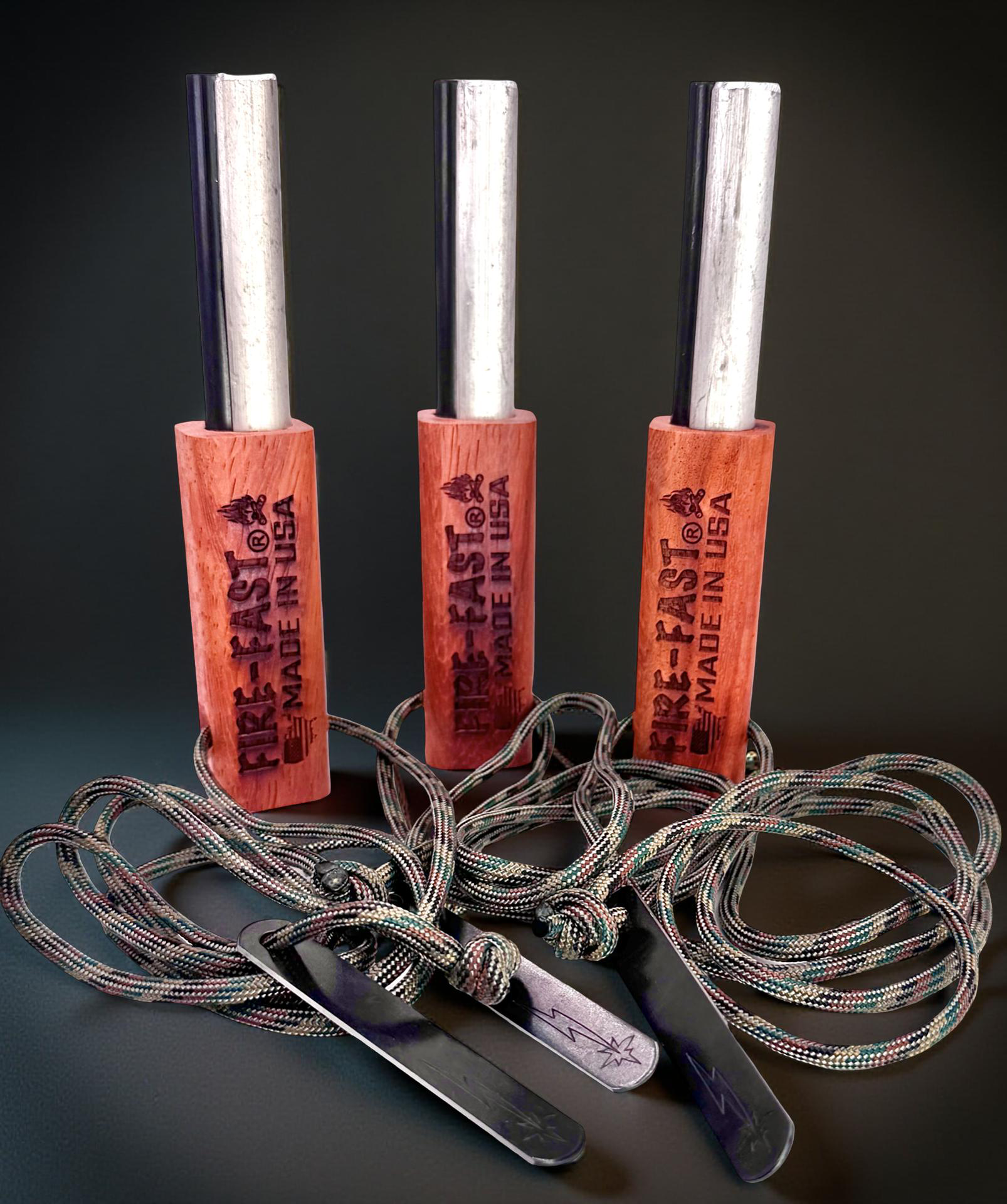 Fire-Fast Kamper Trio – three Kamper Lanyard ferro rods with 40" paracord lanyards and strikers against mountain backdrop – buy 3 and save promotion.